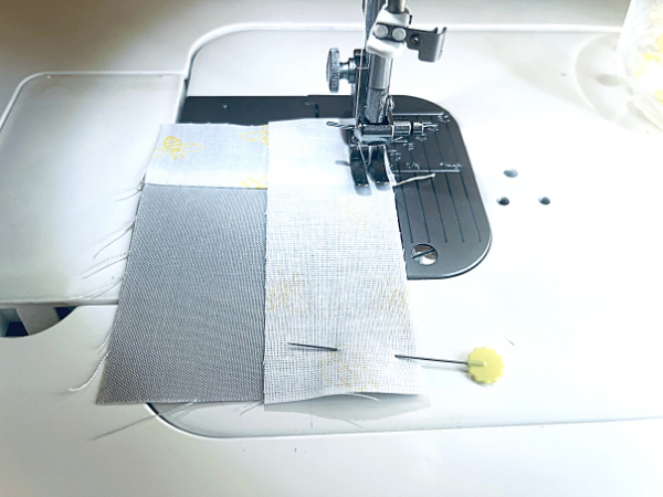 quilting patchwork being sewn on sewing machine