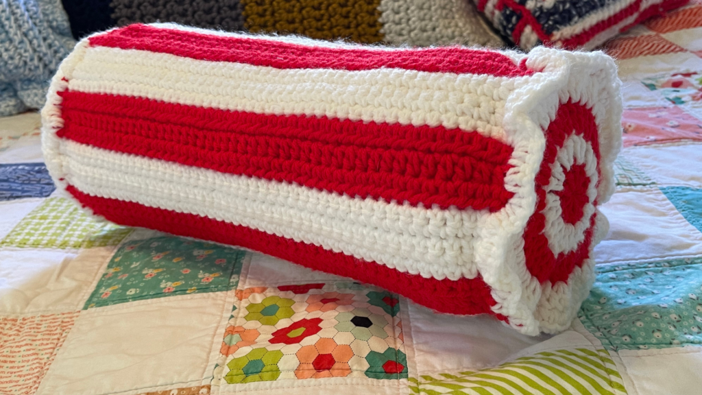 crochet pillow on quilt