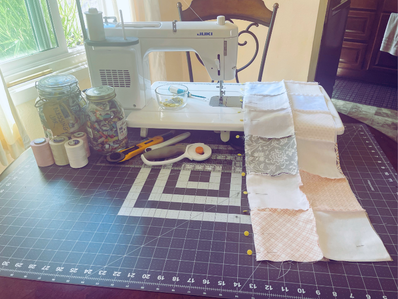 Sewing quilt rows together with sewing machine