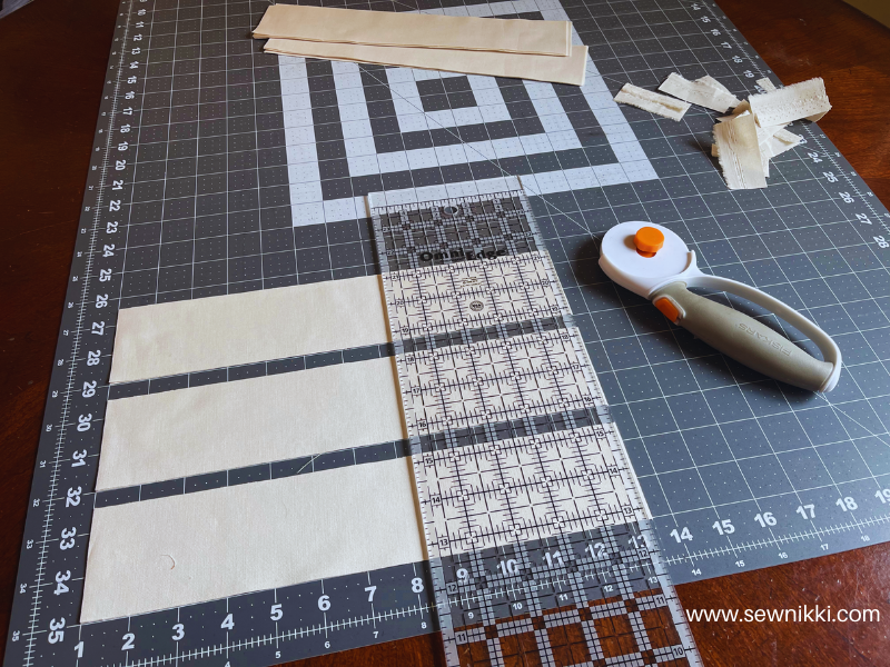 sub cutting fabric strips into rectangles for quilt sashing