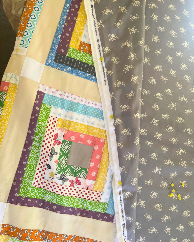 How to Sandwich A Quilt Step-by-Step Tutorial - Sew Nikki