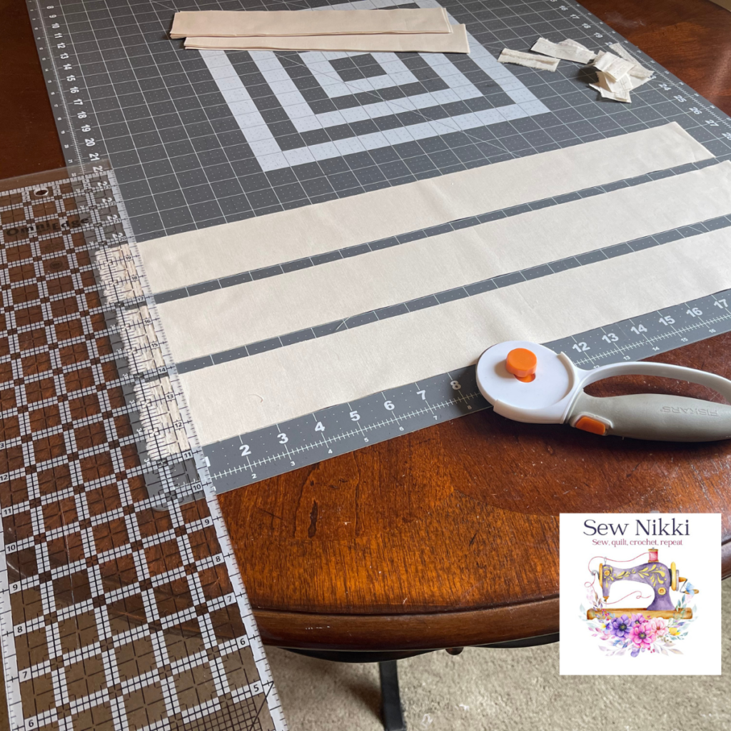 Using rotary cutter and quilt ruler to cut fabric