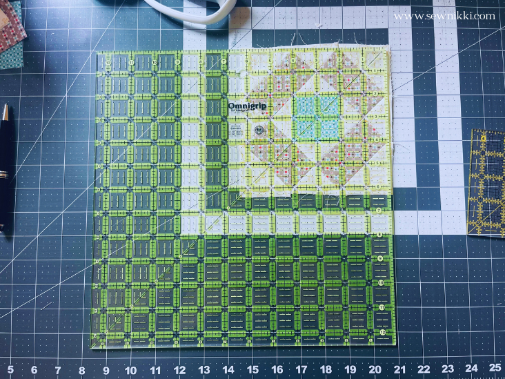 trimming an unfinished quilt block with 12.5" quilt ruler