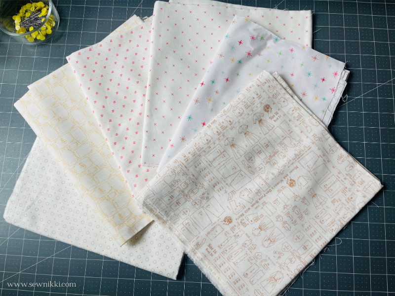 examples of low volume cotton fabrics on cutting mat