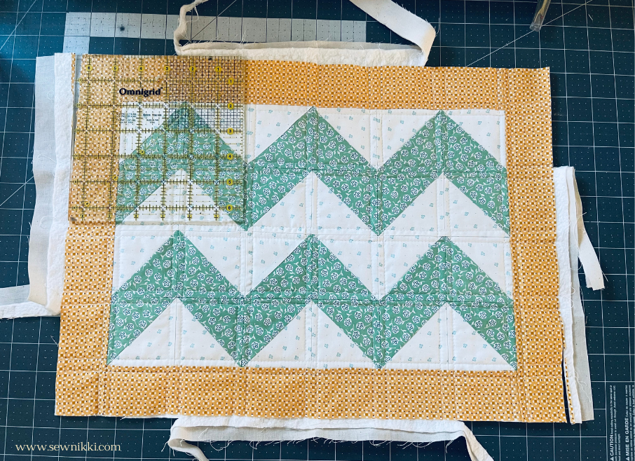 squaring up quilt top with square ruler in all corners