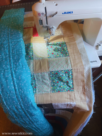 machine quilting twin size quilt on sewing machine