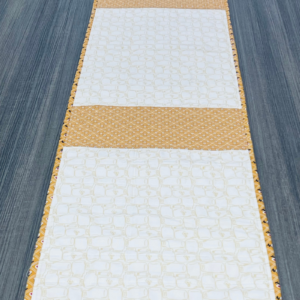Pieced quilt backing ideas – Quilt As You Go Table Runner Free Pattern, using two backing fabrics by Sew Nikki.