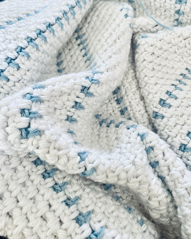 Fast easy baby blanket crochet pattern - finished blanket by Sew Nikki.