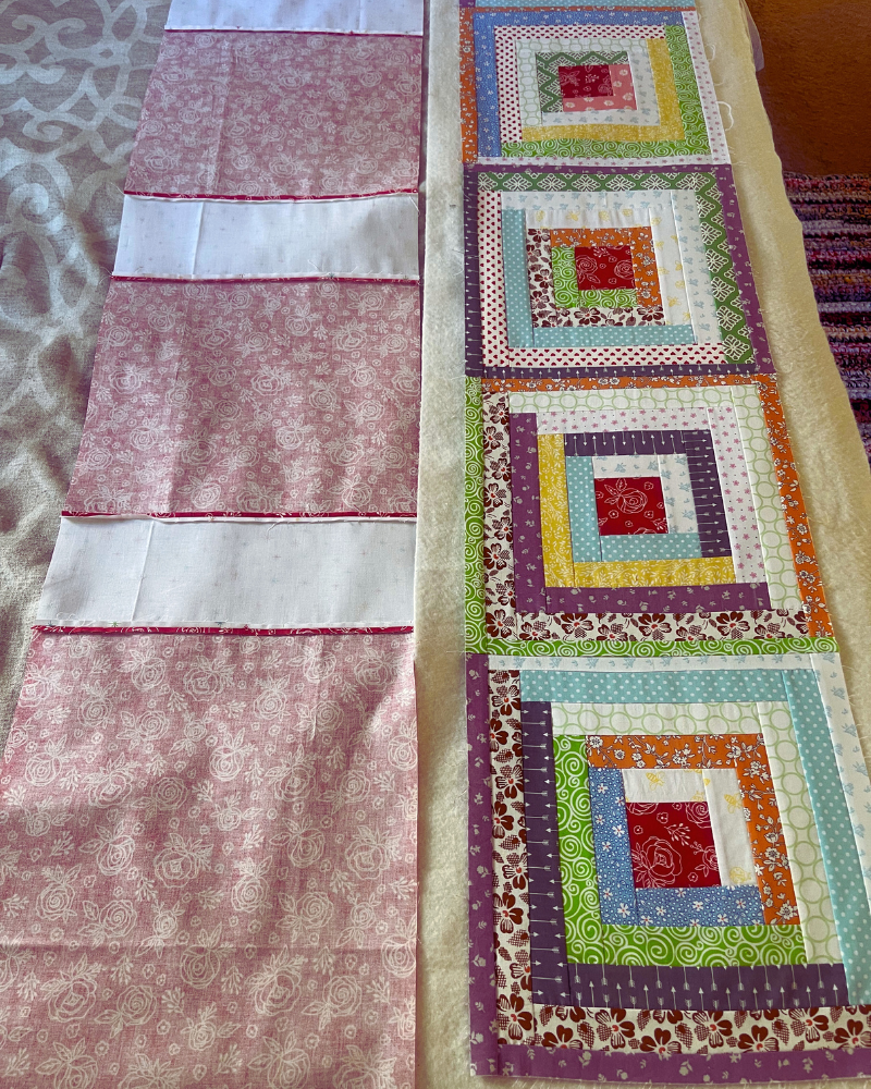 Log Cabin Table Runner Free Pattern by Sew Nikki - Basting with quilt top, batting and pieced backing