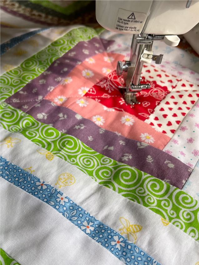 How to quilt on a regular sewing machine - Use straight lines and plan out your stitch lines before you begin by Sew Nikki.