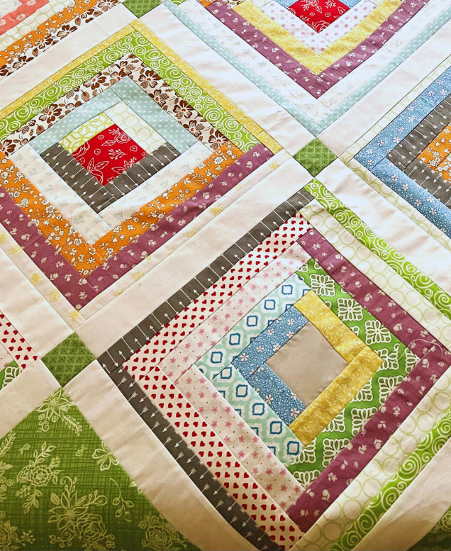 How to quilt on a sewing machine - look at your blocks and select a quilt design that you like.  