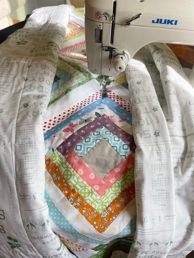 How to quilt on a sewing machine - straight line quilting on a domestic sewing machine by Sew Nikki.
