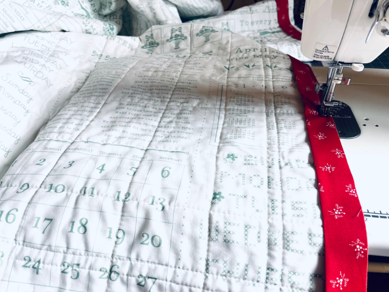 How to sew a binding on a quilt by Sew Nikki - using a sewing machine to attach is the easiest method.