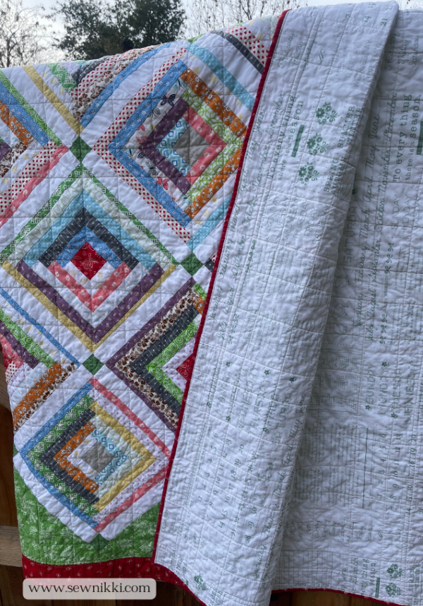Log Cabin Quilt Pattern On Point by Sew Nikki - Completed quilt folded showing quilt top and backing fabric.