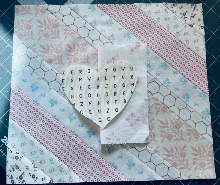 How to sew a heart directly on a quilt block by Sew Nikki.