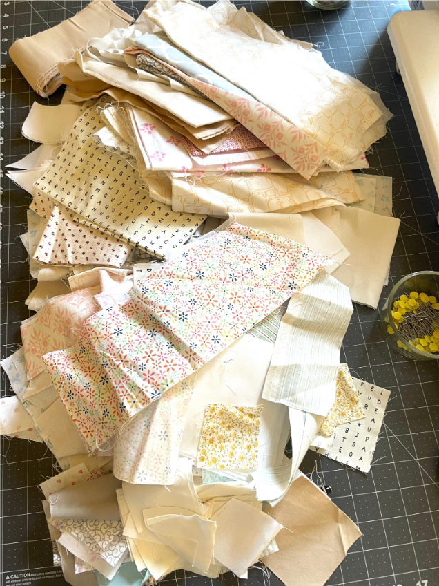 Scrappy Quilt Ideas - pile of low volume fabric scraps by Sew Nikki.