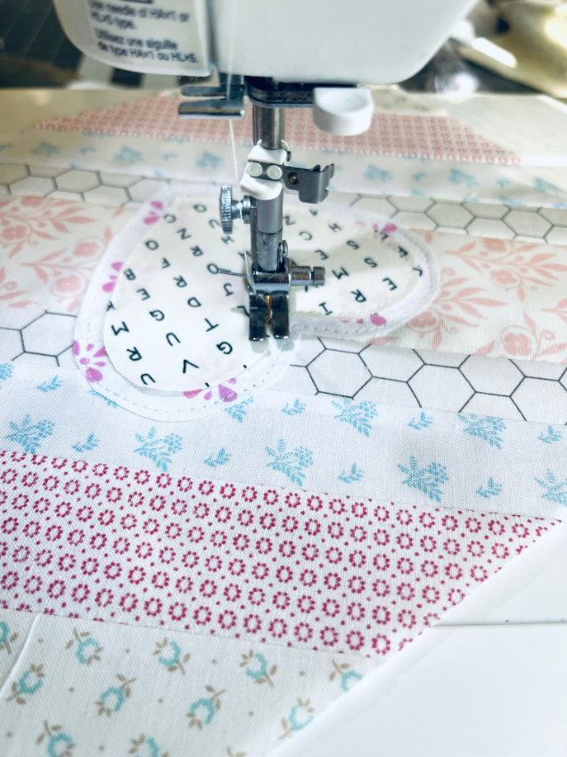Sew Nikki - Sewing heart shapes directly onto quilt block is so easy.