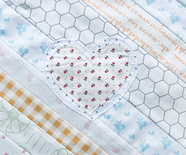 Scrappy quilt block ideas using sewn on hearts the quick and easy way by Sew Nikki.
