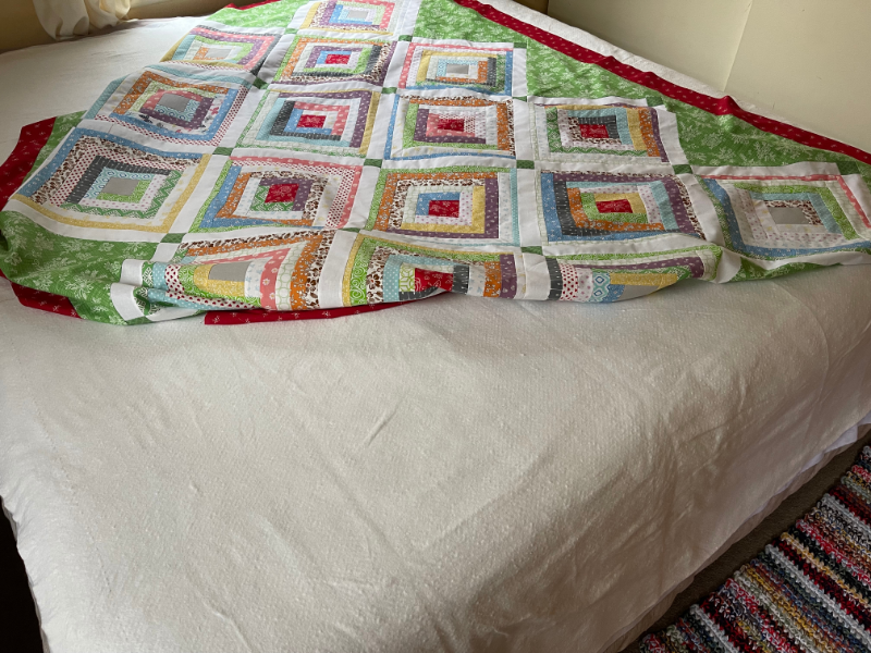 Small space quilting - Spray basting a quilt using the bed as a smooth work surface by Sew Nikki.
