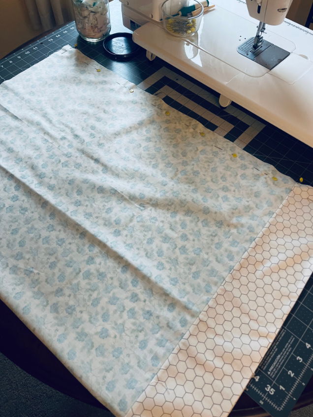 How to sew a pillowcase - turn right sides touching and sew together by Sew Nikki.