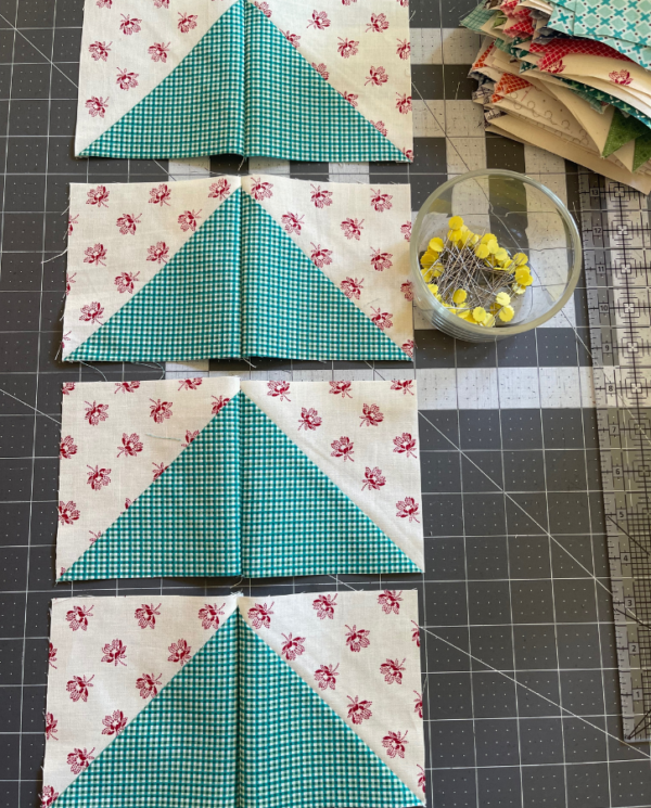 Using flying geese units to create geese blocks for quilt by Sew Nikki.