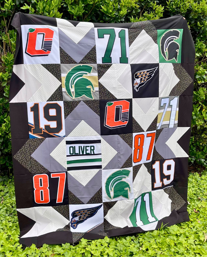 How to make a t-shirt quilt - completed quilt top by Sew Nikki.