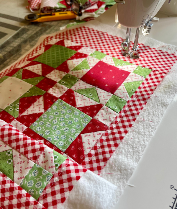 Machine quilting Little Stars table runner by Sew Nikki.