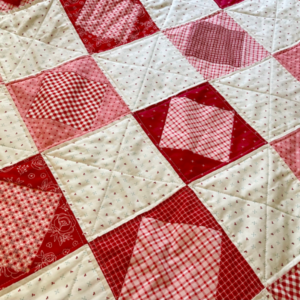 Blushing Blocks Quilt – combination of straight line and diagonal lines machine quilting by Sew Nikki. Blushing Blocks Quilt - combination of straight line and diagonal lines machine quilting by Sew Nikki.