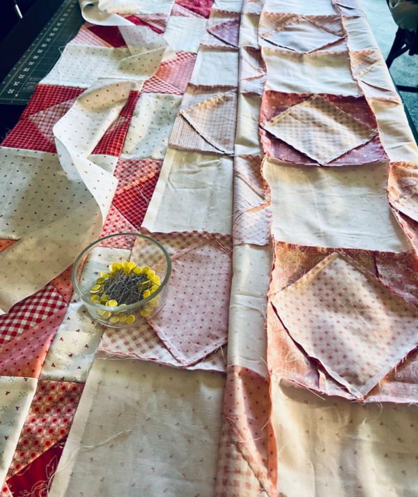 Blushing Blocks by Sew Nikki - sewing quilt rows together.