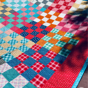 Free quilt pattern, diagonal line machine quilting on Checkerboard quilt by Sew Nikki Free quilt pattern, diagonal line machine quilting on Checkerboard quilt by Sew Nikki