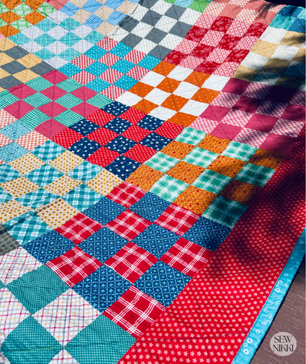 Free quilt pattern, diagonal line machine quilting on Checkerboard quilt by Sew Nikki