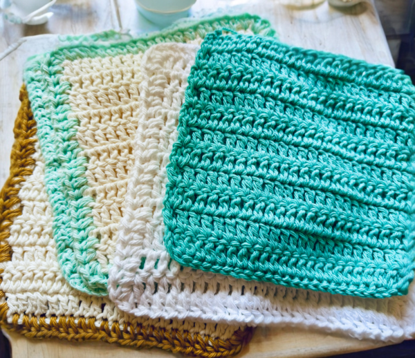 crochet dishcloths on table