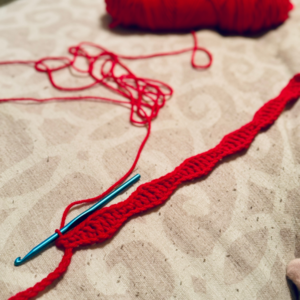 Forming the "waves" with the wave stitch crochet scarf pattern by Sew Nikki.