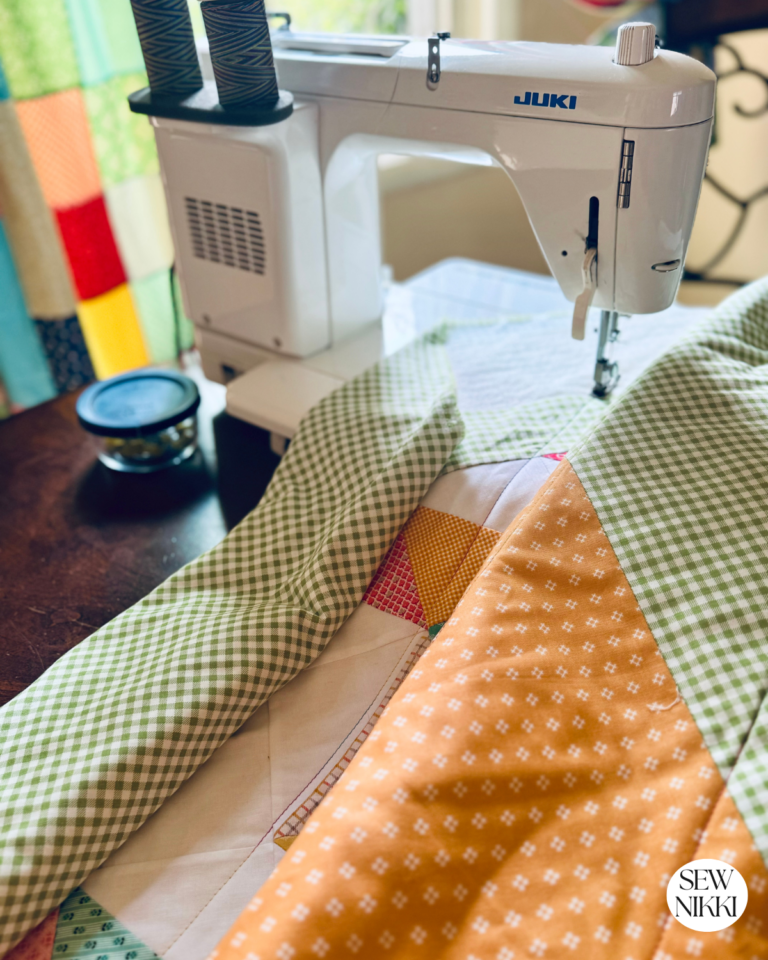 Best Large Throat Quilting Machine Under $900 by Sew Nikki - quilting the chevron quilt on my Juki.