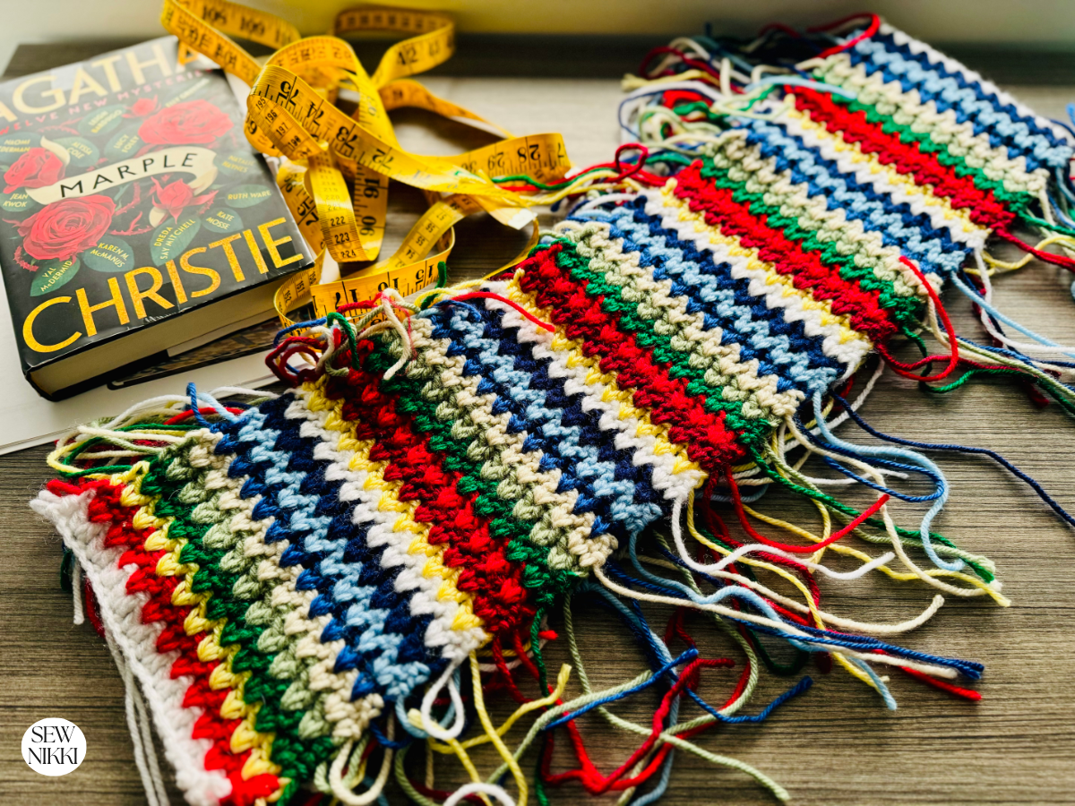 Easy Double Crochet V-Stitch Scarf Pattern by Sew Nikki - scarf with tails that need weaving in.