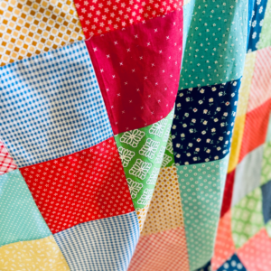 How to sew a curtain tutorial by Sew Nikki - Up close photo of my charm square curtains.