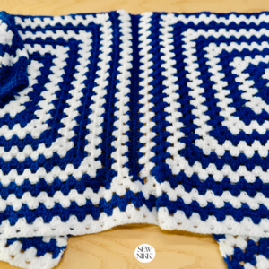 Finished back side of hexi cardigan free crochet pattern by Sew Nikki.