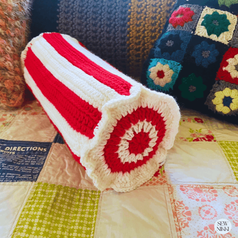 Candy cane pillow finished on my bed by Sew Nikki