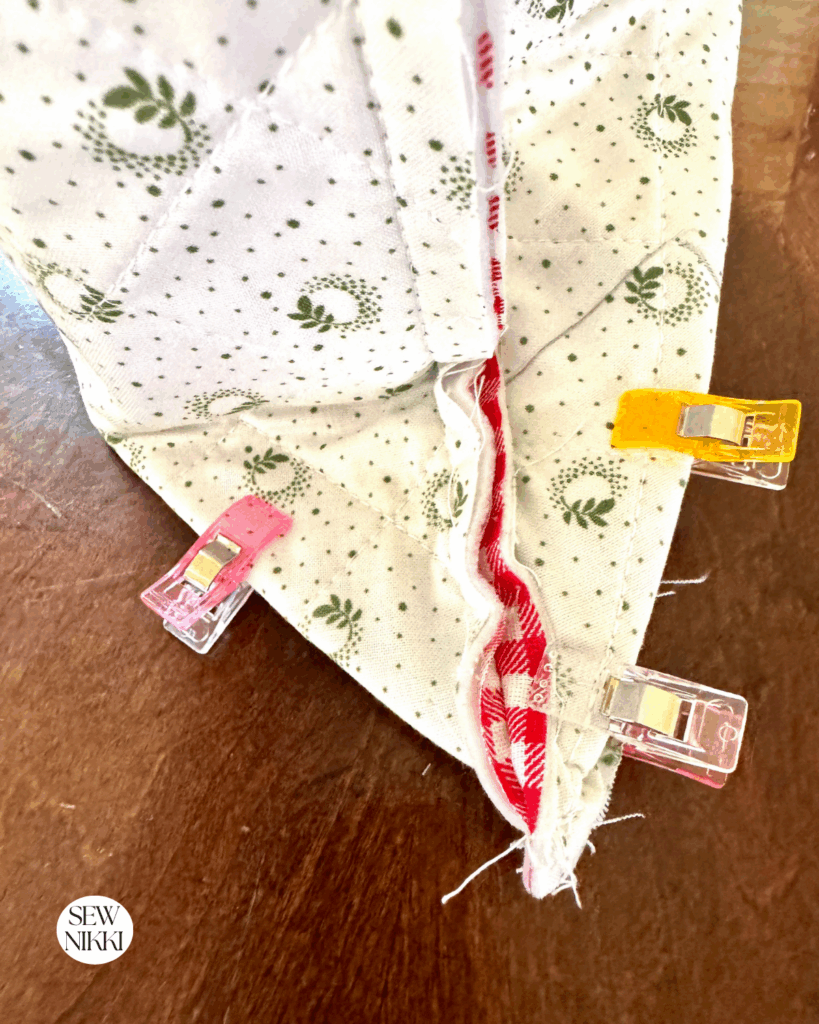 Pinch the square together to box it, then sew together using a half inch seam allowance.