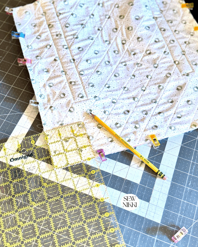 How to box a corner sewing tutorial by Sew Nikki - use a ruler and pencil to mark out the square.