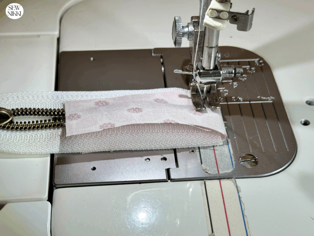 How to sew a zipper by Sew Nikki - Attaching zipper tabs to a zipper.