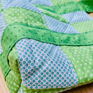 Large Patchwork Tote Bag Sewing Pattern by Sew Nikki Large Patchwork Tote Bag Sewing Pattern by Sew Nikki - up close shot of the bag from the bottom side.
