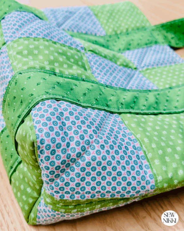 Large Patchwork Tote Bag Sewing Pattern by Sew Nikki - up close shot of the bag from the bottom side.