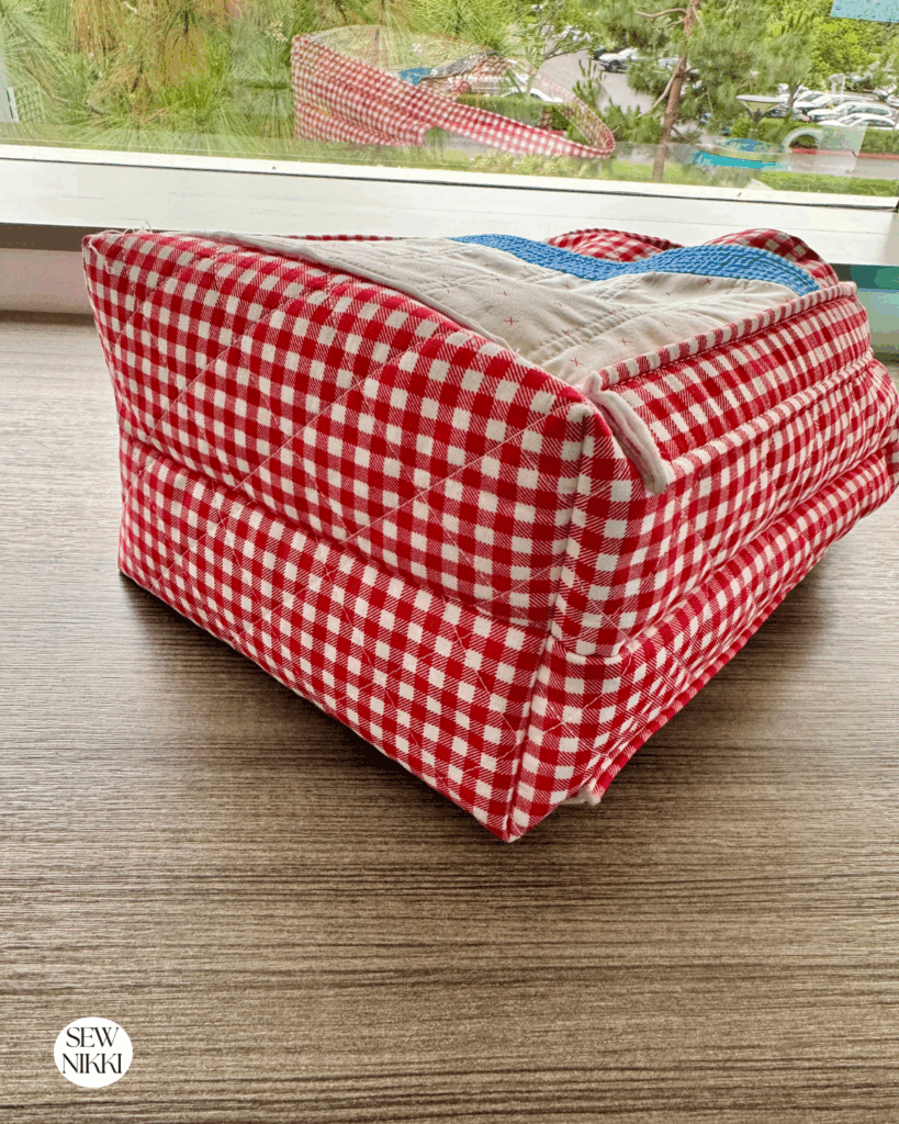 Learn to sew a flat bottom on any bag by Sew Nikki - boxed corner method.