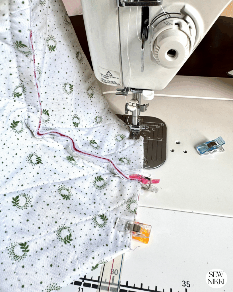 Pinch the square together to box it, then sew together using a half inch seam allowance.