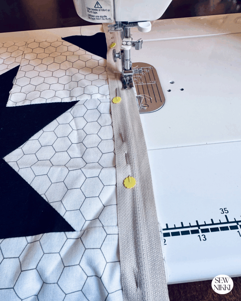 Attaching the front pillow cover to the zipper by Sew Nikki