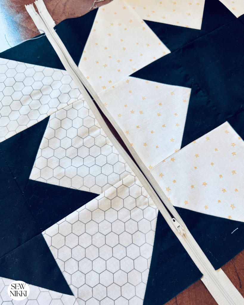 Open the zipper before you sew the sides together or else you won't be able to turn the pillow cover right side out by Sew Nikki