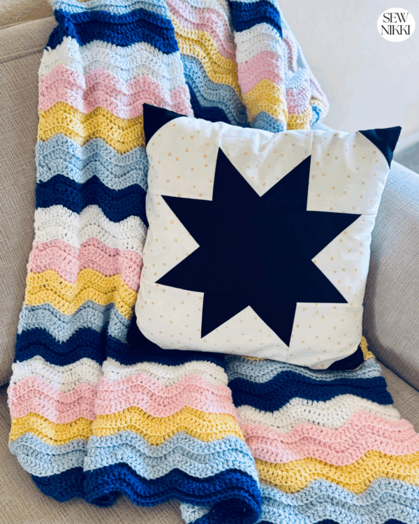 Ripple Wave Crochet Throw by Sew Nikki - finished double crochet pattern for beginners draped over couch.