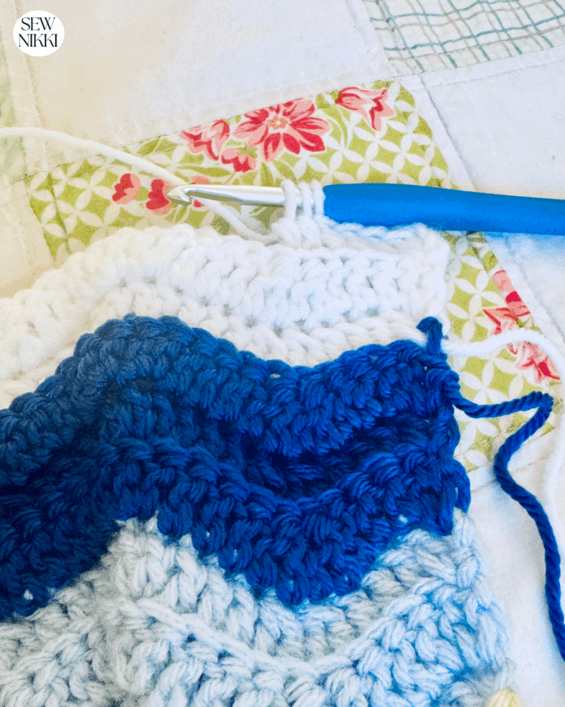 Ripple Waves Throw - working the first dc2tog decrease of the free crochet pattern.