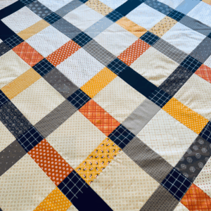 Disappearing 9 Patch Quilt Pattern On Point by Sew Nikki - finished quilt top.